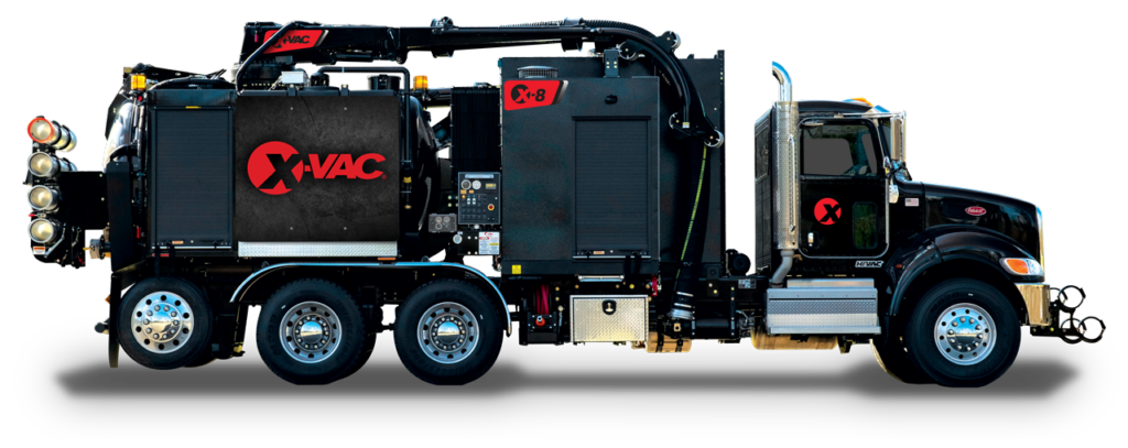 Black X-Vac X-8 hydro-excavation vacuum truck with boom, hose and debris tank — American-made heavy equipment.