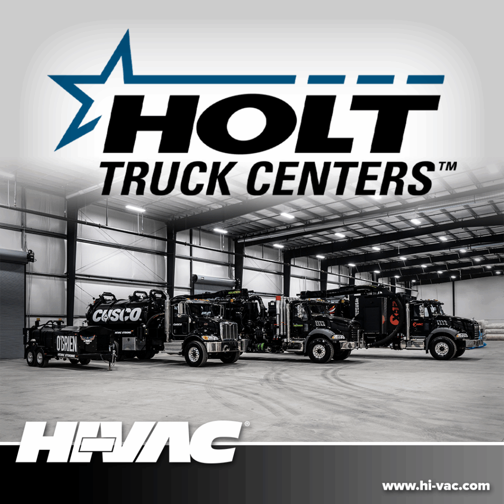 Three black Hi-Vac hydro-excavation vacuum trucks parked in a Holt Truck Centers bay under Holt and Hi-Vac logos.