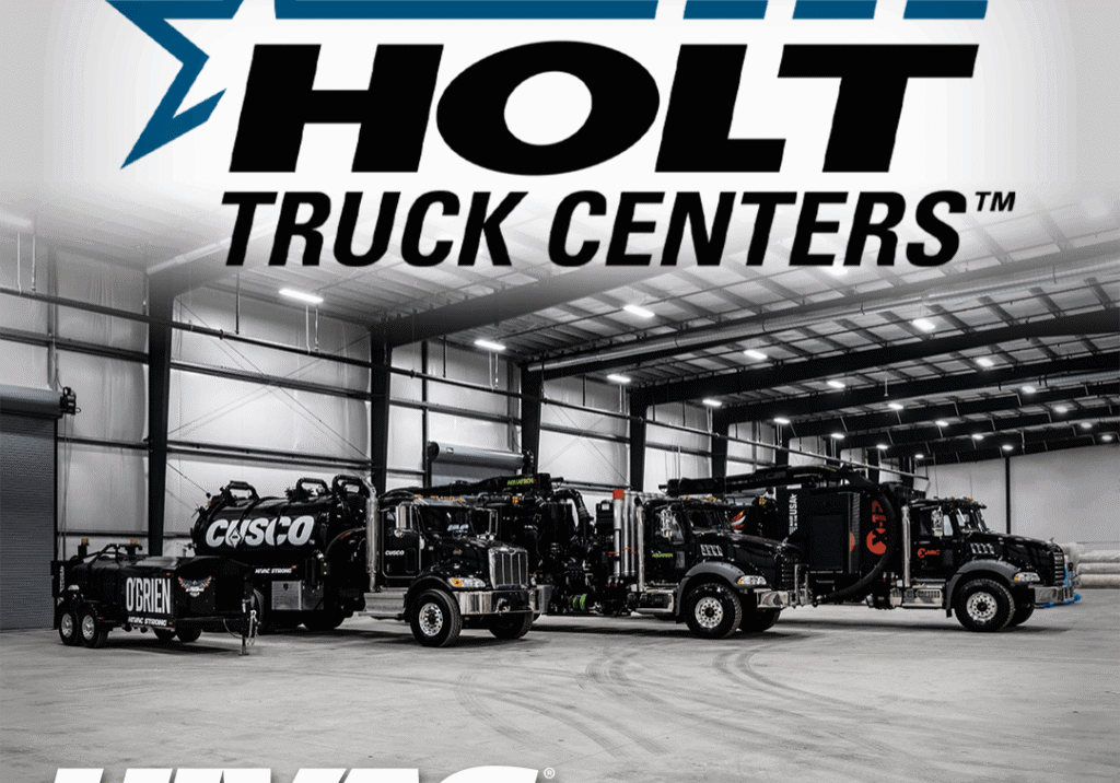 Three black Hi-Vac hydro-excavation vacuum trucks parked in a Holt Truck Centers bay under Holt and Hi-Vac logos.